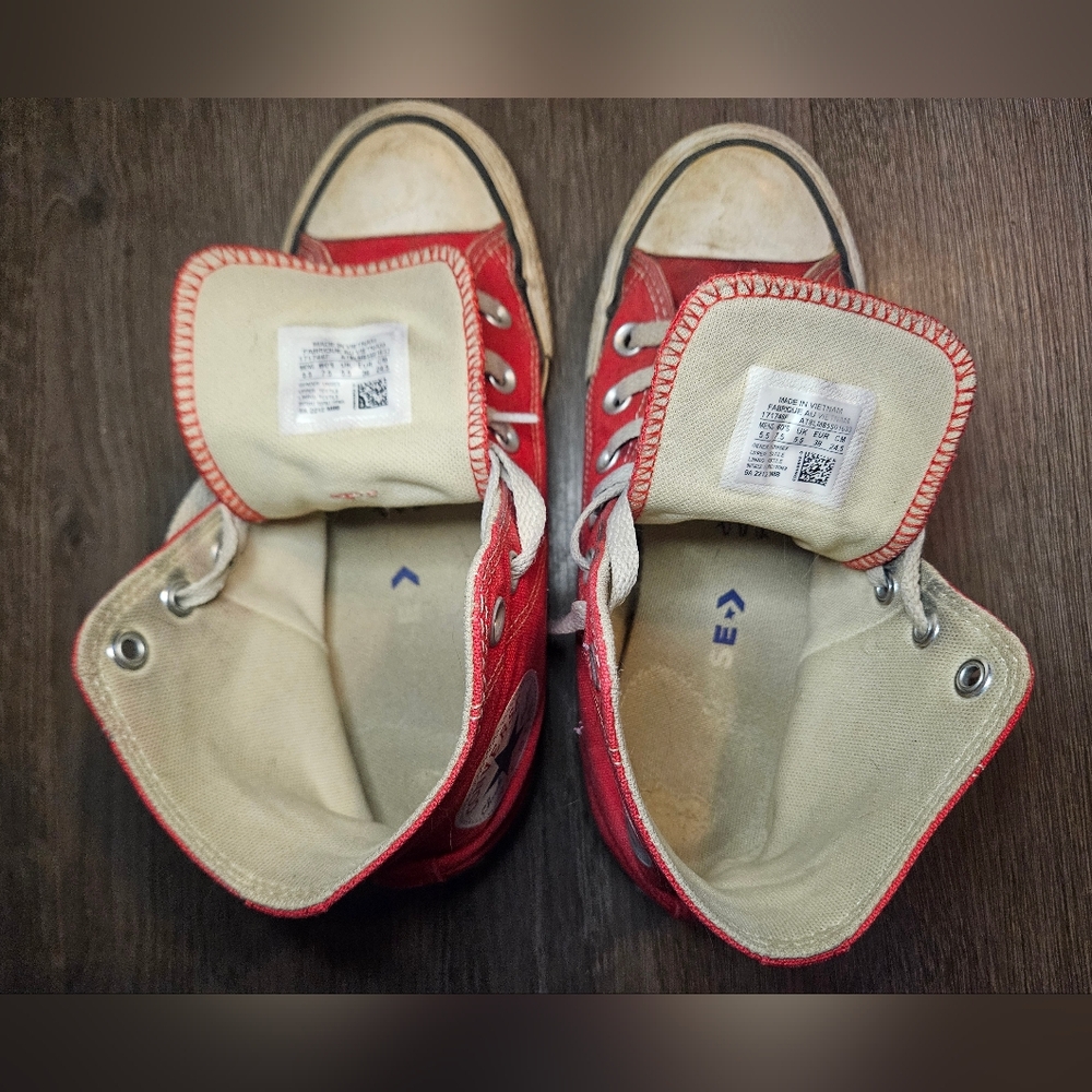 Worn Red High Top Converse Shoes